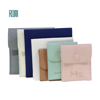 China ROMI Customize Luxury Protable Microfiber Jewelry Storage Small Jewelry Pouch Jewelry With Button Jewelery Snap Bag for sale