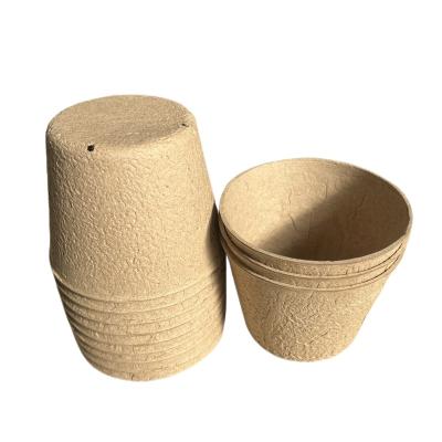 China Cardboard Pulp 10cm Pulp Sowing Cup Around 4 Holes Degradable Paper Yellow Pulp Seedling Cup Cultivation Dry Pressed Flowerpot for sale