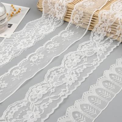 China Fancy Lace Trims DIY Non-Elastic Nylon White Floral Trims Ribbon Little Lovely Floral Tape Embroidered 70MM For Dress Sewing Decoration for sale