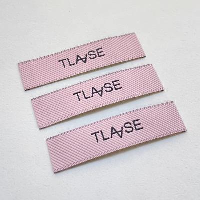 China Washable OEM Tags Label For Clothing Customize Home Textiles Logo Iron On Embroidery Woven Patch for sale