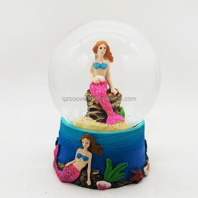 China Africa Resin Water Globe With Letters Tropical Custom Resin Mermaid Souvenir Marine Life Dolphin Water Globe for sale