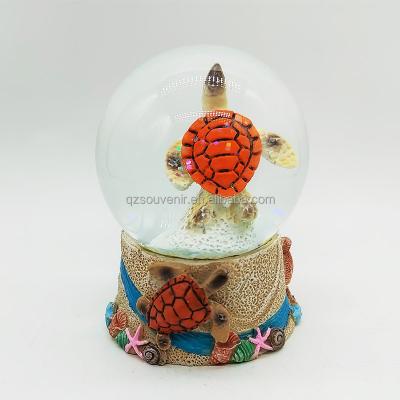 China Custom Wholesale Polyresin Sea World Place Theme Snow Turtle Beach Resin Africa 3D Souvenir Dolphin Souvenir Water Tourist Globe for sale