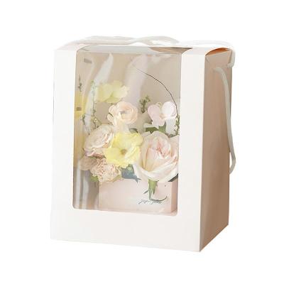 China Recycled Materials Paper Bag Flowers Paper Bag Portable Flower Gift Box Hand Held Packaging Box Transparent Window for sale