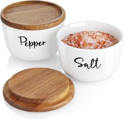 China Sustainable Salt Cellar 2 Ceramic Jar Set With Lid Modern Ceramic Salt Pepper Container With Lid Wooden Salt Box Bowls for sale