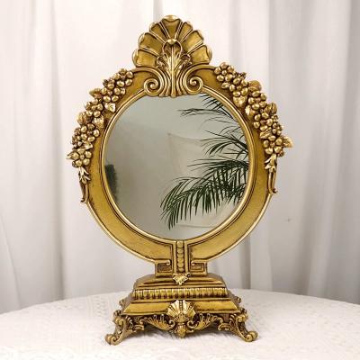 China Lighted Nordic Gold Retro Style Home Table Stand Makeup Decorative Resin Frame Mirror for sale