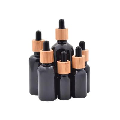 China 5ml 10ml 15ml 20ml 30ml 50ml 100ml Matte Black Essential Oil Serum Dropper Tube Cosmetic Paper Glass Bottle With Bamboo Foil Cap for sale