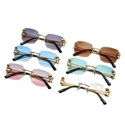 China Famous Brands Metal Rimless Leopard Glass Designer Small Sun Glasses Women Men Fashion Sun Glasses Main Sunglasses for sale