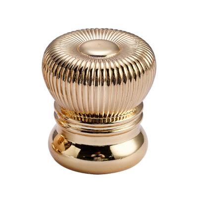 China Non Spill Art Stripe Zamac Perfume Bottle Single Cylindrical Gold Cap For Glass Bottle for sale