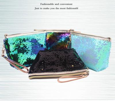 China Fashion Custom Makeup Storage Bags Laser Magic Flip Sequined Hand-held Pouch Portable Travel Glitter Make Up Cosmetics Bags for sale