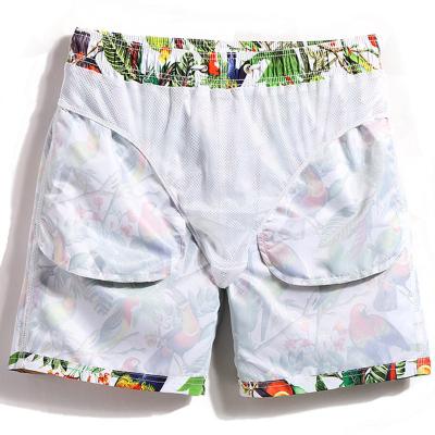 China QUICK DRY Mens Fifth Pants Beach Shorts With Bird Print With Mesh for sale