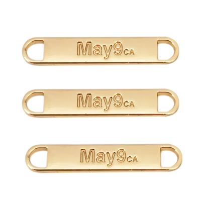 China Sustainable Wholesale Design Name Logo Metal Tags Custom Two Hole Apparel Metal Label for sale