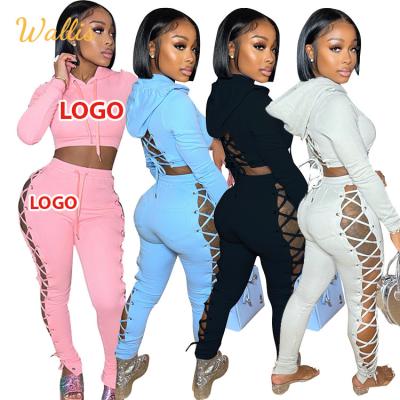 China New Autumn Women Breathable Hollow Out Bandage Two Piece Set Custom Logo Jogger Hoodies Pants Sweatsuit Set for sale