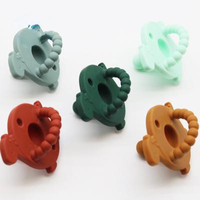 China BPA Free Custom Dinosaur Shape Soother Pacifiers Food Grade Silicone Baby Newborn Pacifier for sale