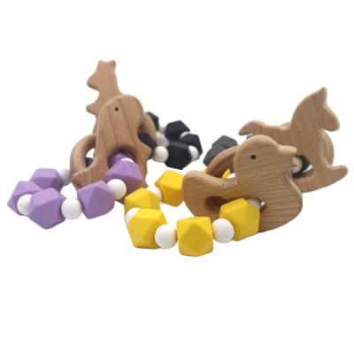 China Popular Natural Graduated Soft Toy Amazon Food Grade Beech Wood Silicone Beads Baby Teether Rattle Ring Toys for sale