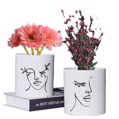 China Nordic Art Portrait Matte Ceramic Planter Pot Minimalist OEM&ODM Logo Balcony Shop White Plant Custom Flower Pots With Hole for sale