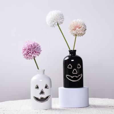 China Modern Farmhouse Creative Halloween Party Ghost Face Flower Vase Black Mini Ceramic Vase White For Decoration for sale