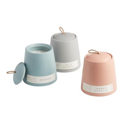 China Creative Pink Matte Ceramic Candle Jars Sky Blue Home Decoration Warm Trapezium Gift Home Decor Jars With Lid for sale