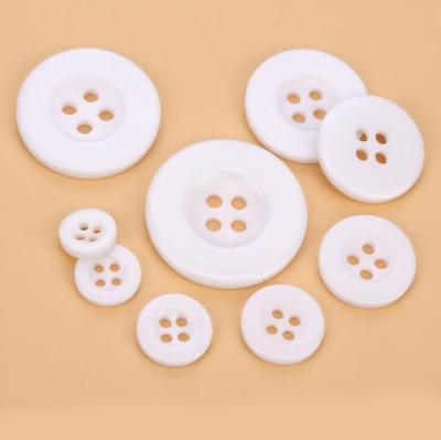 China Logo Engraved Resin White Buttons custom made wholesale washable for apparel for sale