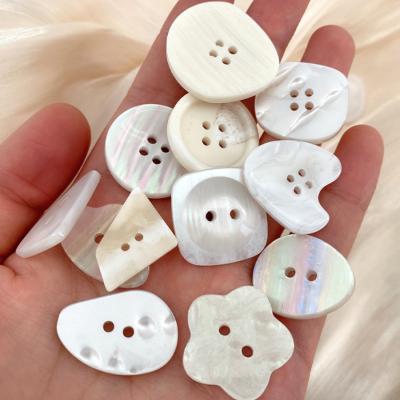 China Wholesale White Dry Cleaning Fancy Form Shell Button For Women Garment for sale