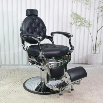 China Modern High End Barber Shop Furniture Armchair Can Rotate And Lift Stainless Steel Black Metal Barber Chair for sale