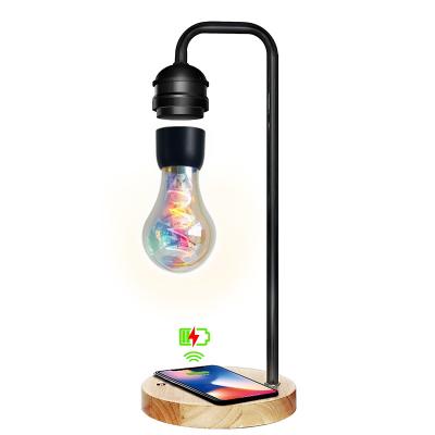 China Smart Creativity Levitating Mobile Phone Table Light Magnetic Levitation Lamp Colorful Radio Charger Suspension Floating Led Bulb for sale