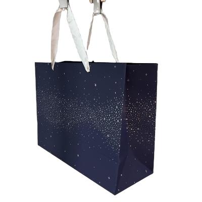 China 100% Eco-friendly High End Blue Starry Paper Bags Shopping Mall Shoe Box Apparel Gift Paper Bag Packaging Bag for sale