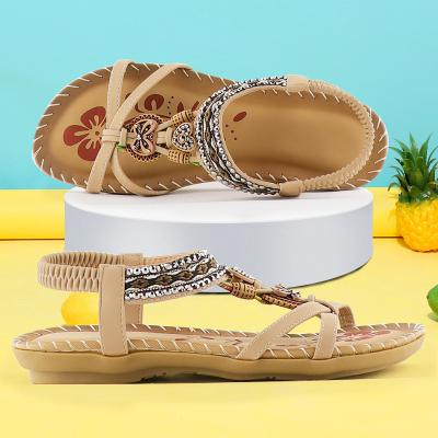 China Flat 2022 hot sale woman shoes hollow out outer beach rhinestone open toed flat sandals for sale