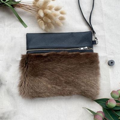 China Customized Name Smooth Leather Hair On High Quality Cowhide Pouch Bag Clutch Bags For Women for sale