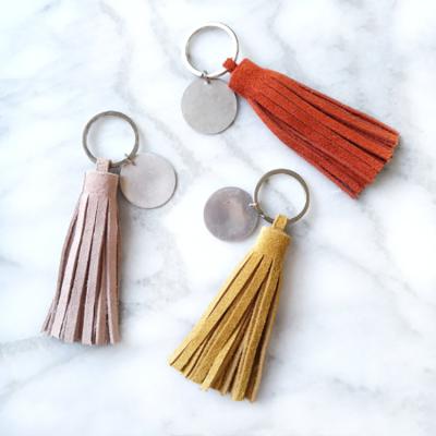 China Cow Decoration Leather Key Chain Tassels For Bag Keychain Custom Logo Tassel Accessories for sale