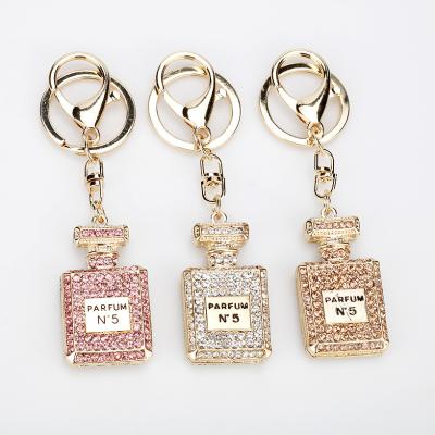 China Casual Famous Brand Luxury Rhinestone Full Crystal Perfume Bottle Key Chain For Women for sale