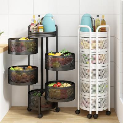 China Viable Rotating Shelf 360 Degree Multifunctional Fruit Rack Floor Round Household Shelf Kitchen Vegetable Storage Baskets With Wheels for sale