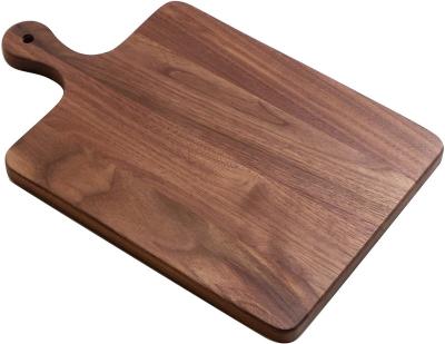 China Sustainable Walnut Wooden Cutting Boards Serving Boards Wooden Cutting Board With Handle for sale