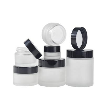 China Personal Care 10g 50g Clear Glass Cosmetic Jar Black Glass Lids Frosted for sale