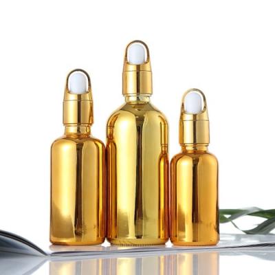 China Personal Care Luxury Glass Dropper Lid Flower Basket Cover Essential Oil Gold Bottle for sale