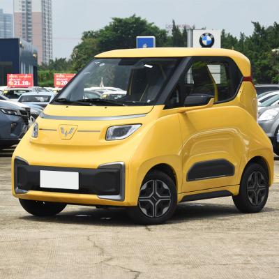 China Wuling leather ev100km nano flexible, new air conditioning closed comfortable four-wheel power energy vehicle for sale