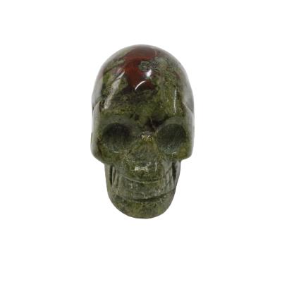 China China Wholesale Hand Carved Natural Stone Skulls Blood Dragon Crystal Skulls Carved For Decoration for sale