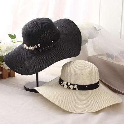 China Hot Selling Striped Classic Round Cap Brim Straw Hats Lady Leisure Pearls Summer Sun Beach Wide Brim Hats For Women for sale