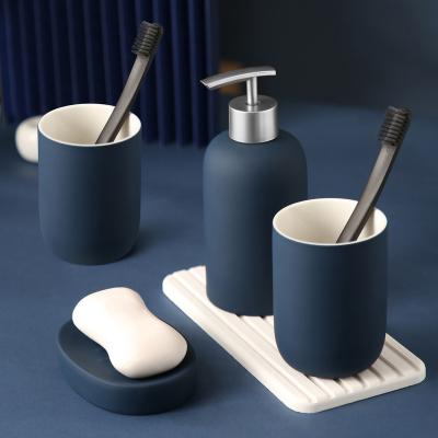 China Sustainable Modern Blue Art Design Ceramic Bathroom Accessories White Set Toilet Accessory 4Pcs for sale