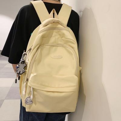 China Waterproof Simple Female High Aspect High School College Students Backpack Niche Level Cream School Bag Girls for sale