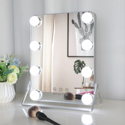 China Modern cheap led smart lighted alminium light dressing table touch screen frameless hollywood makeup turn position mirror for sale