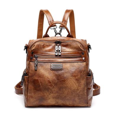 China 2021 Southeast big travel waterproof working ladies backpack vintage color patchwork faux oil leather backpack pin jing woman shoulder bag for sale