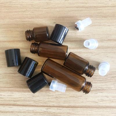 China 1ml 2ml 3ml 5ml Essential Oil Brown Rollball Bottle Essential Oil Submarine Fragrance Rollball Bottling Bottle for sale