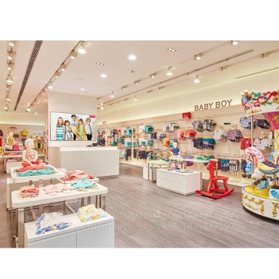 China MDF Kids Clothing Store Fixtures Designs Decoration Kids Store Display With Metal Racks for sale