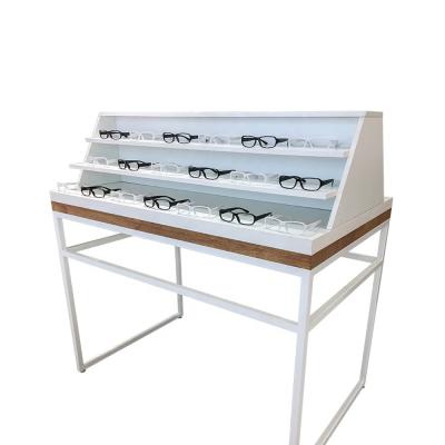 China Custom Optical MDF Shop Rack Gondola POS Display Stand Table Logo Retail Shop Fittings Wood for sale