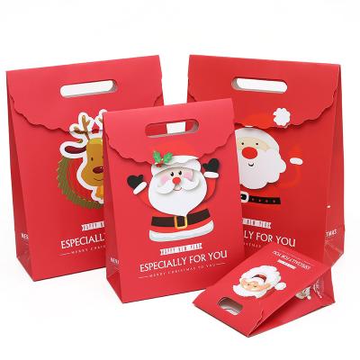 China Recycled Materials Christmas Paper Bag Recyclable White Paper Bags Shopping Paper Bags Reusable Logo Printed for sale