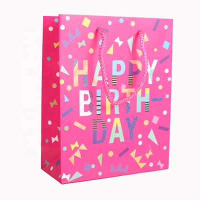 China Recyclable Hot Sale Custom Printed Logo High Quality Birthday Party White Cardboard Gift Bag With Twist Handle for sale