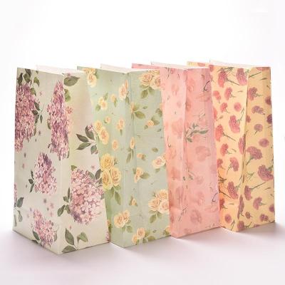 China Factory Direct Environmental Protection Recyclable Customized Floral Printed Color Kraft Paper Bag for sale