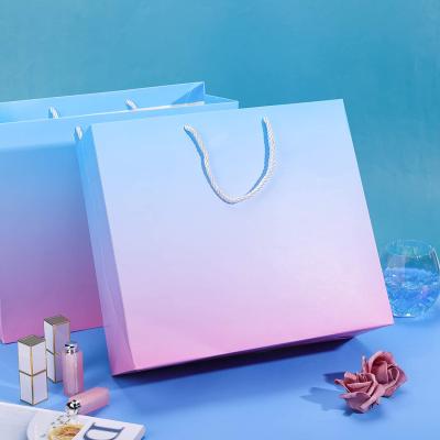 China Recyclable Wholesale Custom Color Cardboard Gift Craft White Shopping Bag With Handle for sale