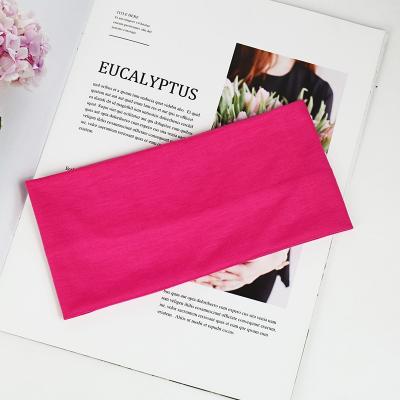 China 2022 Wholesale Yiwu sports headband wide elastic candy color gym sweat headband solid color sports girls hair absorbing band for sale