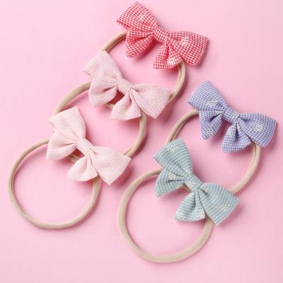 China Korean version fashion hot sale children's hair circle fashion new side bow rope side bow short thin hair band nylon elastic wrap main waist for sale